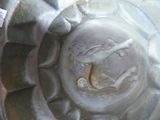 a close up of a metal object with a sticker on it
