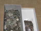 a box full of buttons and a bag of coins