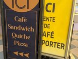 two signs on the floor in front of each other