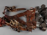 an image of a piece of leather with metal decorations on it