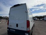 a white van that is parked in a parking lot