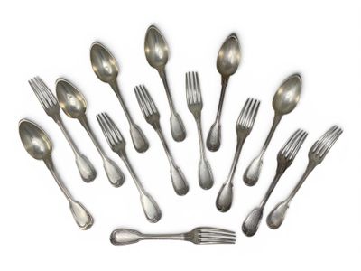 a lot of silver spoons and forks arranged in a circle