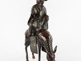 une image représentant une statue en bronze d'un homme à cheval