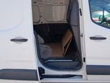 a white van with its door open and a box in the back