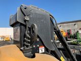 a close up of a fork on a construction vehicle