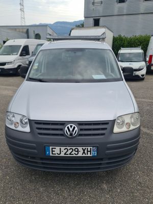 a silver van that is parked in a parking lot