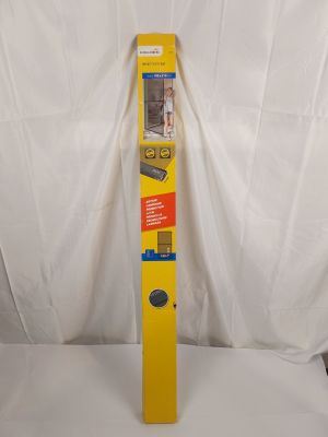 a close up of a tall yellow object on a white surface