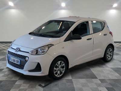 a picture of a white car parked in a garage