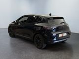 the rear end of a black car in a white room
