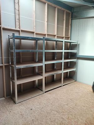 a room with shelves and a motorcycle in it