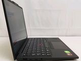 the laptop is open on a white surface with a white wall behind it