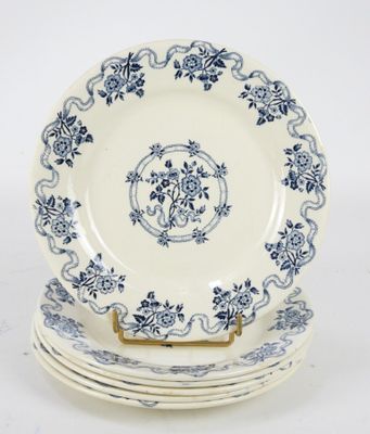 three plates with blue and white designs are stacked on top of each other