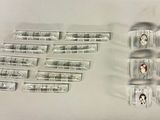 a lot of pills and condoms sitting on a table