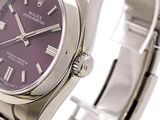 a purple watch with roman numerals on the face