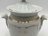 an image of a white and gold covered bowl with a lid