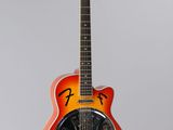 an orange electric guitar with a black fretset sitting on a stand