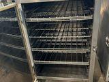 an image of a stainless steel oven with a rack of food inside of it