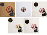 four coasters with stickers depicting a rat and a mouse on them