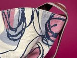 a purse that has a flower pattern on it