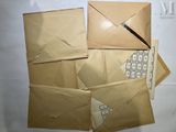 several envelopes and a keyboard are sitting on a table