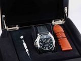 a box with a watch and a pen in it