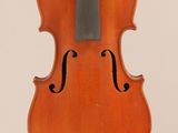 an old violin with a bow hanging from the back