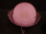 a pink hat that is sitting on top of a table