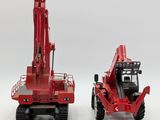 two red toy trucks that are sitting side by side