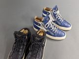 two pairs of blue and white sneakers sitting next to each other