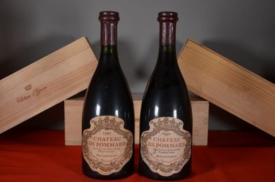 two bottles of wine sitting next to each other on a table