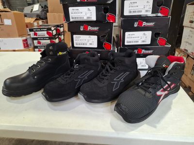 five pairs of shoes on a table in a store
