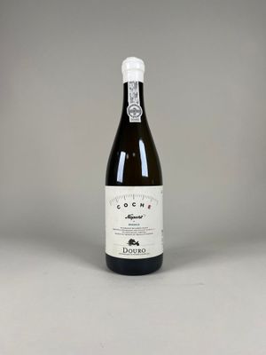 a bottle of wine that is sitting on a table