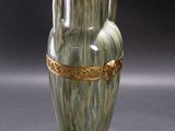 a vase that is sitting on a black surface