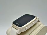 a smart watch that is sitting on top of a stand