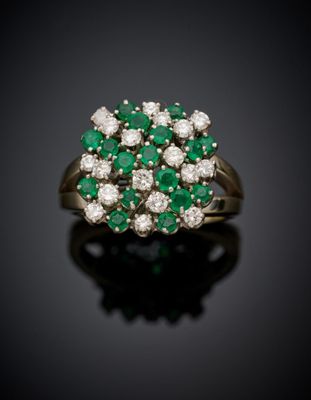 an emerald and diamond cluster ring