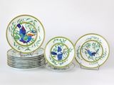 a lot of plates with birds painted on them