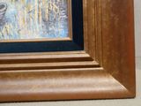 a picture of a cat that is sitting in a picture frame