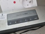a remote control sitting on a table next to a power strip