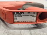 a close up of an orange drill with a label on it