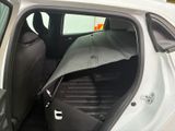 a car that has a umbrella in the back of it
