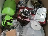 a cardboard box full of assorted items in it