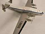 a model of an airplane that is flying in the sky