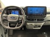 the interior of a car with a steering wheel, dashboard, and entertainment system