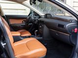 the interior of a car with a tan leather seat and tan leather seats