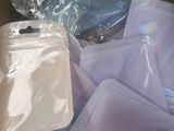 a cardboard box filled with many different types of cloths