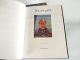 an open book with a picture of a man in a suit on it
