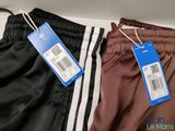 two men ' s pants with a price tag on them