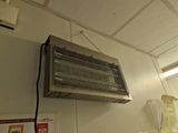 a heater hanging from the ceiling in a room