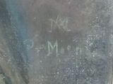 a close up of a piece of metal with writing on it