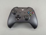 a close up of a game controller on a table